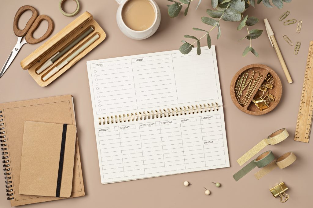 Mockup of weekly or productivity planner and office stationery