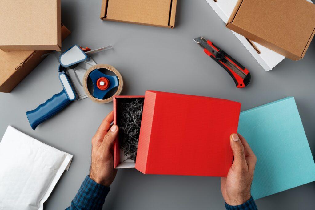 Above table top view of warehouse preparing post courier delivery package