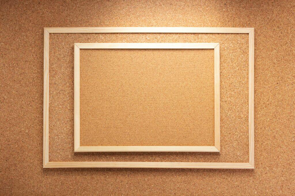 cork board in wooden frame as background