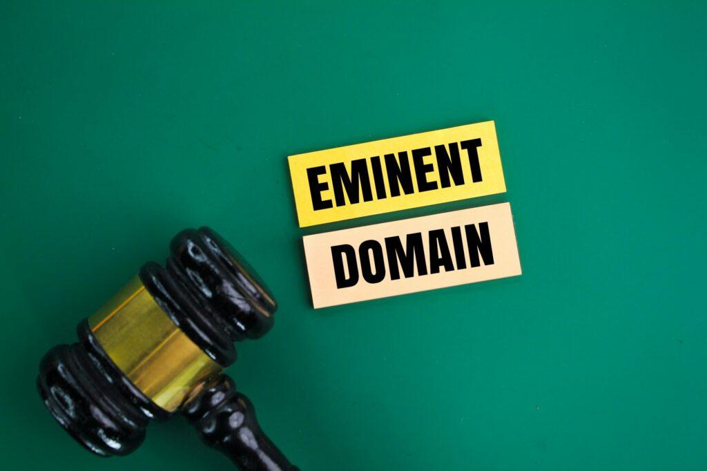 judge's gavel and colored paper with the words Eminent Domain